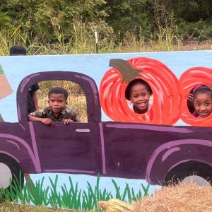 3 kids at pumpkin farm